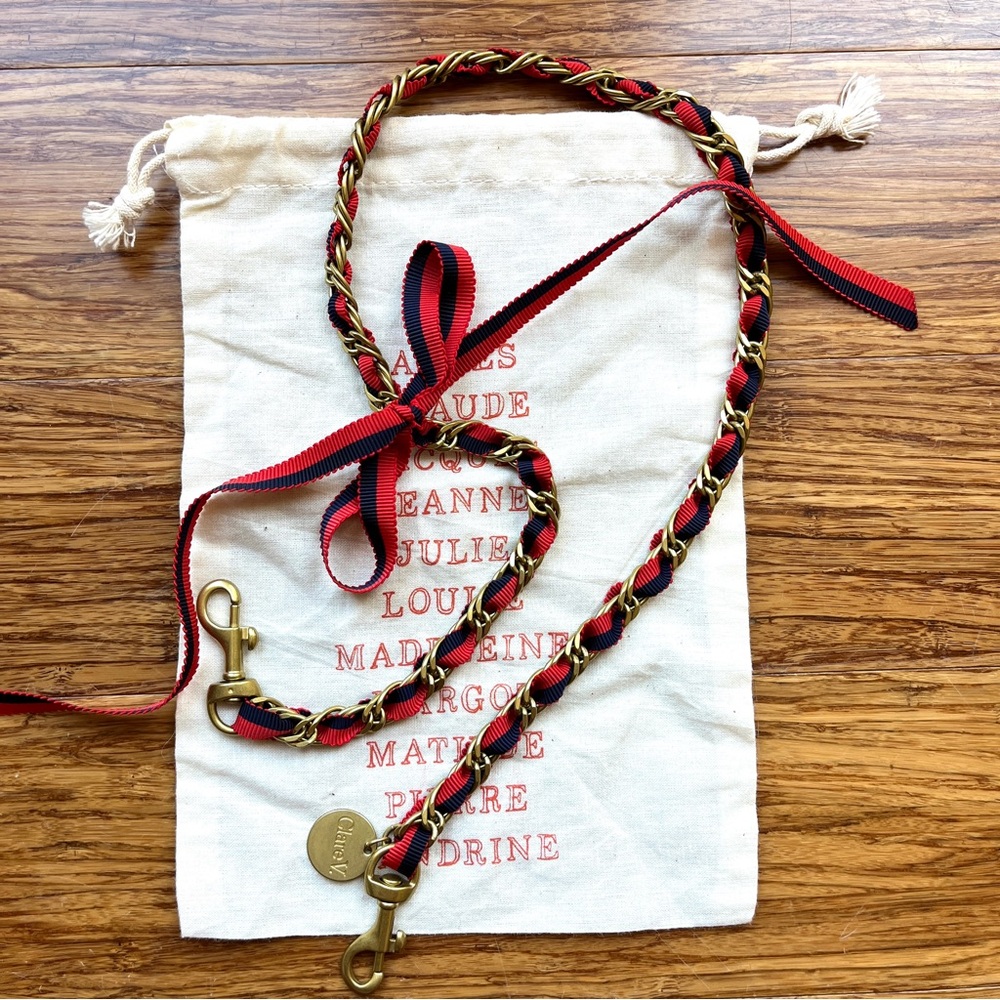 Clare V shoulder strap brass chain with navy and red grosgrain ribbon.